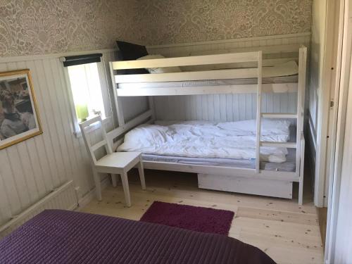 Postel nebo postele na pokoji v ubytování Nice holiday house at horse farm with lake and sauna