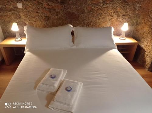 Ένα ή περισσότερα κρεβάτια σε δωμάτιο στο Casas do Torreão 3 casas de alojamento local