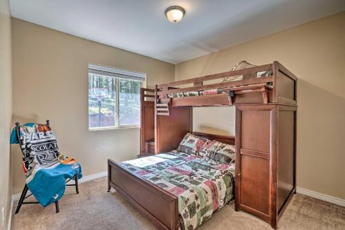 a bedroom with a bunk bed and a chair at Hilltop Haven in Florissant Deck and Mountain View! in Florissant