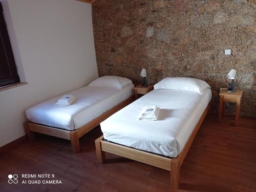 Ένα ή περισσότερα κρεβάτια σε δωμάτιο στο Casas do Torreão 3 casas de alojamento local