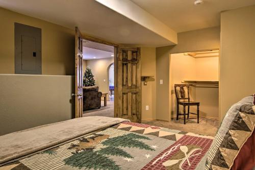 a bedroom with a bed and a living room at Hilltop Haven in Florissant Deck and Mountain View! in Florissant