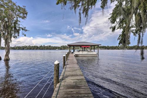 a boat tied up to a dock on a lake at Georgetown Escape with Slip Boat Access Only in Georgetown