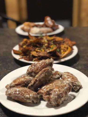 three plates of food on a table at River Inn in Nipawin