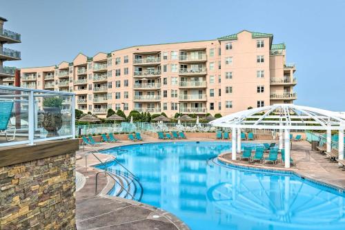a swimming pool in front of a large apartment building at Private Beach Access Wildwood Crest Retreat in Wildwood Crest