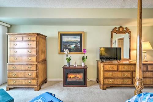 a bedroom with a fireplace and a dresser and a tv at Private Beach Access Wildwood Crest Retreat in Wildwood Crest
