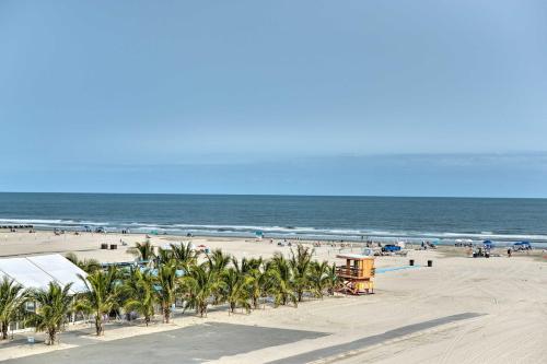 a beach with a bunch of palm trees and the ocean at Private Beach Access Wildwood Crest Retreat in Wildwood Crest