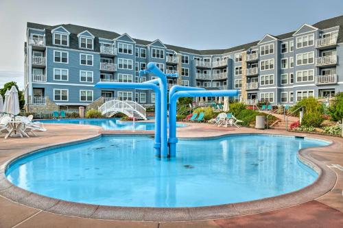 a pool with a slide in front of a apartment complex at Private Beach Access Wildwood Crest Retreat in Wildwood Crest