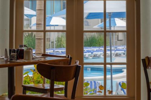 a view of a pool through the window of a restaurant at Pan American Oceanfront Hotel in Wildwood Crest