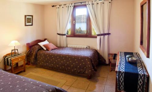 Una cama o camas en una habitación de Bungalows Buena Vista