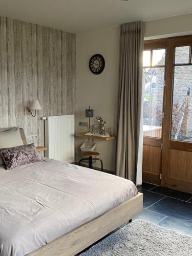 Postel nebo postele na pokoji v ubytování B&B 't Hoveke