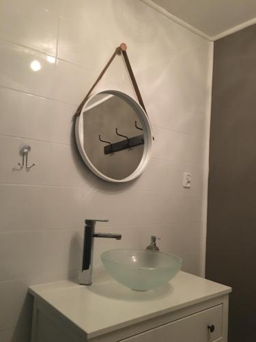 a bathroom with a sink and a mirror on the wall at Stara Studnia in Brzeźnica Stara