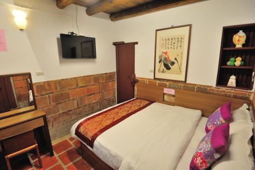 Postel nebo postele na pokoji v ubytování Feng Mao Lin Zhi