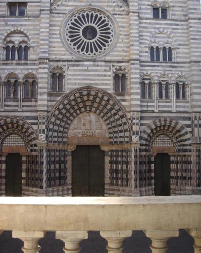 a building with arches on the front of it at Residenza Bendinelli-Sauli in Genova