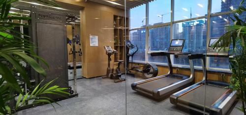 a gym in a building with a view of the city at Holiday Inn Express Jinan High-Tech Zone by IHG in Jinan
