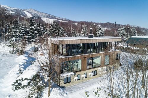 a building in the snow on a mountain at Yama no Oto in Furano