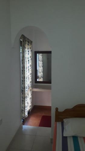 Postel nebo postele na pokoji v ubytování Basilico Homestay
