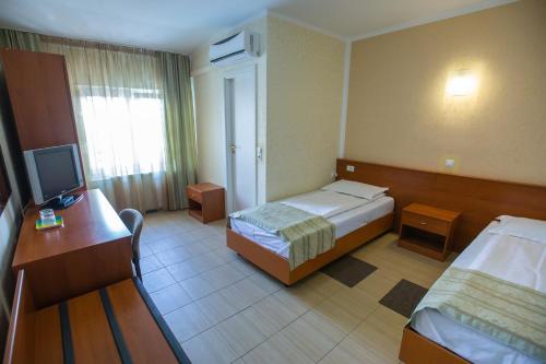 Ένα ή περισσότερα κρεβάτια σε δωμάτιο στο Hotel Seneca