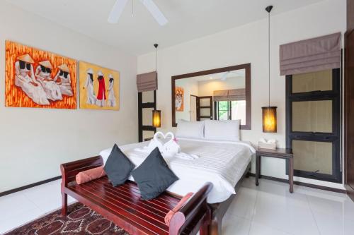 Postel nebo postele na pokoji v ubytování Cocktail Palm Villa