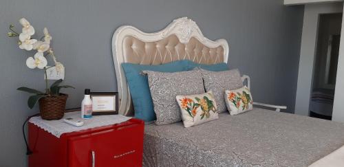 Un ou plusieurs lits dans un hébergement de l'établissement Pousada Cris Garden Bed&Breakfast