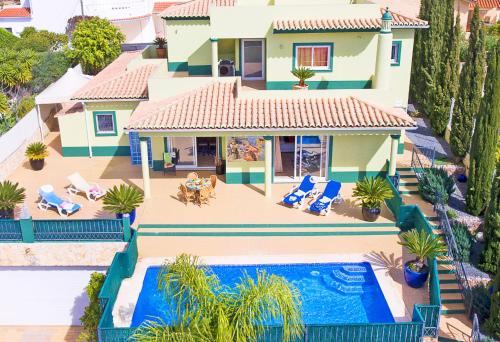 an aerial view of a house with a swimming pool at Villa Saint Thomas by Algarve Vacation in Carvoeiro