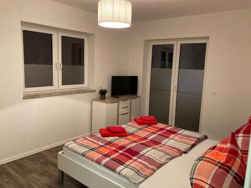 Ένα ή περισσότερα κρεβάτια σε δωμάτιο στο Appartements am Hafen