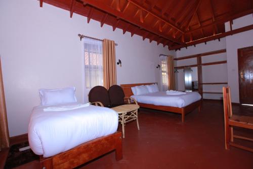 Postel nebo postele na pokoji v ubytování Mtoni Resort, Naro moru