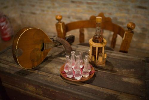 a group of empty wine glasses sitting on a table at Vila Prezident in Sremski Karlovci