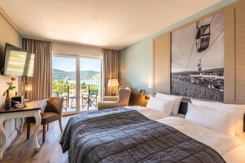 Postel nebo postele na pokoji v ubytování PAPA RHEIN - Hotel & Spa