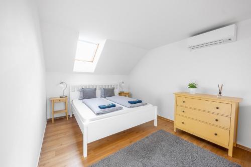 Postel nebo postele na pokoji v ubytování Apartmán Ema Dolní Dunajovice