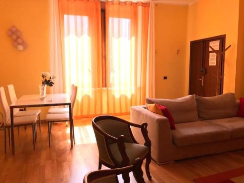 a living room with a couch and a table at Palazzo Fregoso in Garda