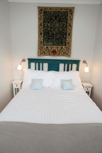 a large white bed with two pillows on it at Micro Barn Mickleton Barnard Castle in Mickleton