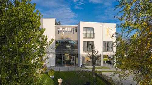 a rendering of a white building with trees at Kucher's Landhotel in Darscheid