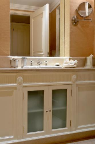 a bathroom with a sink and a mirror at Hotel Sainte Jeanne in Mar del Plata