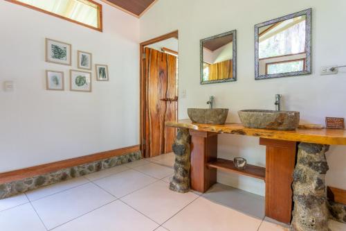 two sinks on a counter in a bathroom at The Jaguars Jungle Rainforest Lodge - All meals included in San Pedrillo
