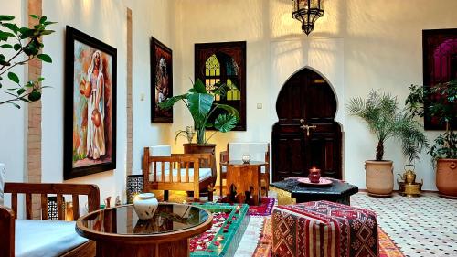 a living room filled with furniture and decor at Dar Salam Palm in Marrakesh