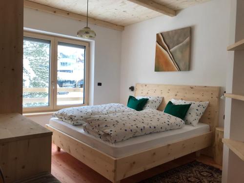 מיטה או מיטות בחדר ב-Cësa Gredine