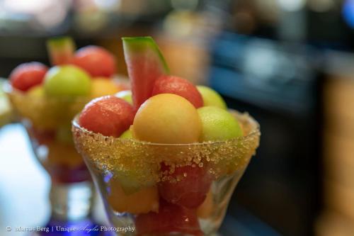 a bunch of fruit in a cup on a table at Adobe Rose Inn in Tucson