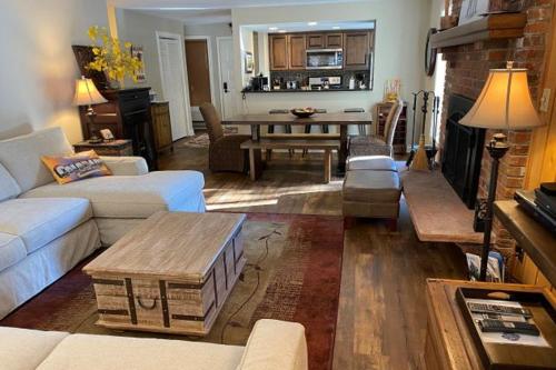 a living room with a couch and a table at Timber Falls 3/2 condo in E Vail 4480 Timber Falls Ct, #1504, Vail, CO 81657 in Vail