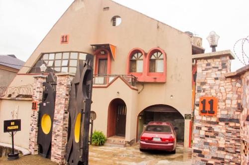 a car parked in front of a building at Double One Suites & Lodge in Ikeja