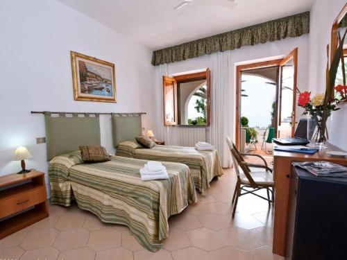 Кровать или кровати в номере Hotel Calabattaglia
