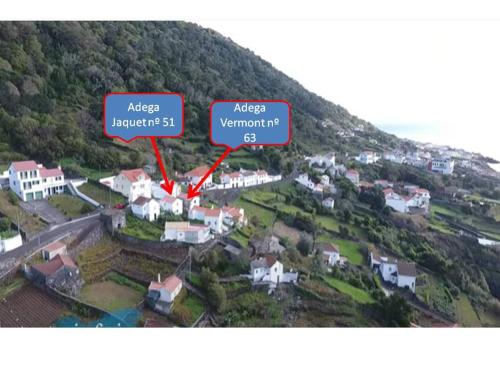an aerial view of a small village with a red sign at Adega Jaquet in Biscoitos