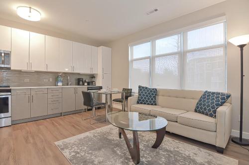 a living room with a couch and a table at Global Luxury Suites East Boston in Boston
