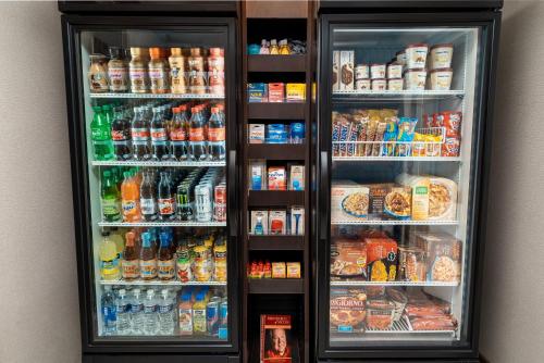 a refrigerator filled with lots of drinks and food at Staybridge Suites - Nashville - Franklin by IHG in Franklin