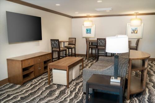 a living room with a flat screen tv and furniture at Staybridge Suites - Nashville - Franklin by IHG in Franklin