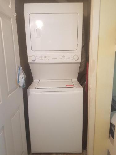 a white washer and dryer in a room at Affordable SPI family condo - walking distance to the beach, Sleeps 6, Third Floor, 2025 Traveler Award in South Padre Island