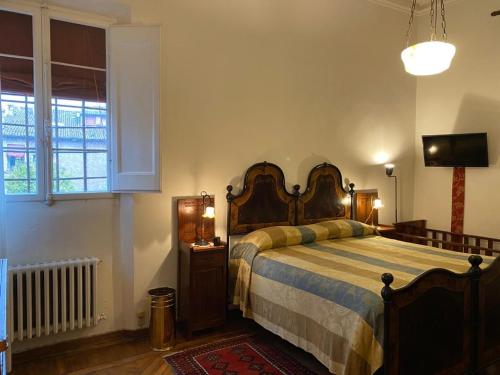 Cama o camas de una habitación en Le Case Cavallini Sgarbi di Rina Cavallini