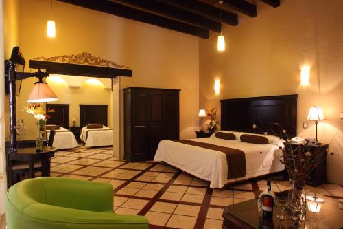 Un pat sau paturi într-o cameră la Hotel CasAntica