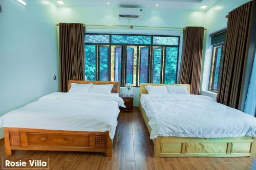 Giường trong phòng chung tại Rosie Villa Ha Giang - Motobikerental & Tour