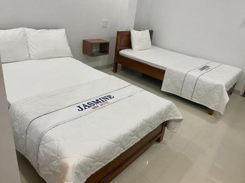 Cama o camas de una habitación en Jasmine Mini Hotel