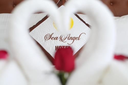 a heart shaped sign with the words real angel at Sea Angel Hotel Halong in Ha Long